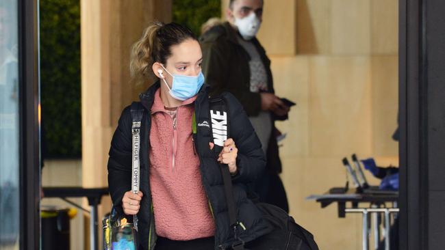 A person leaves quarantine from the IBIS Hotel after spending 14 days in isolation. Picture: Brenton Edwards