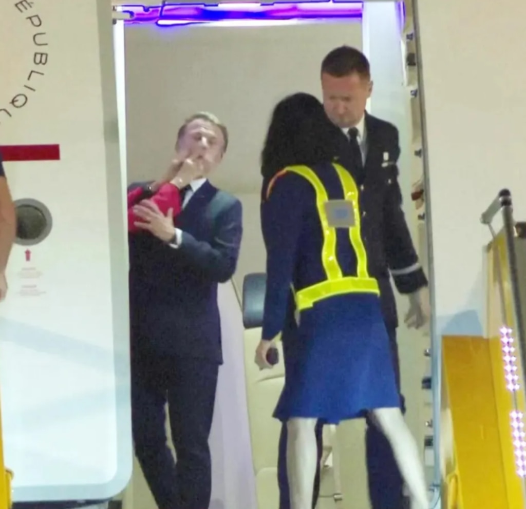 The bizarre moment French President Emmanuel Macron is slapped in the face. Picture: AP
