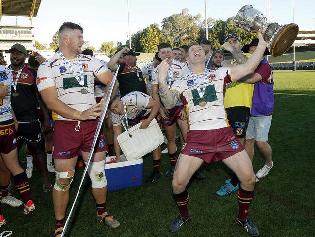 Reluctant hero Josh Bryant (R) celebrates Thirlmere’s grand final victory in the Macarthur Rugby League. Picture: John Appleyard