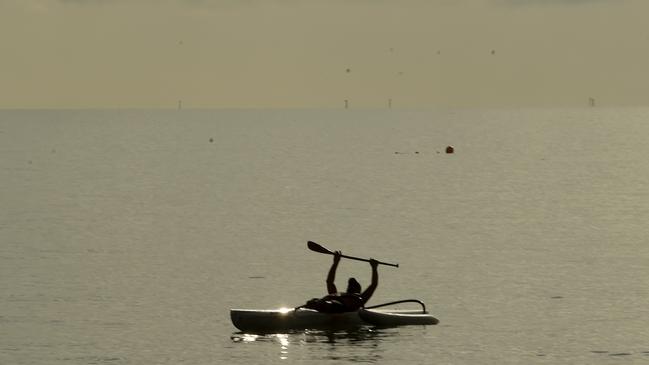 Steve Haronga enjoys an early morning paddle on the Strand. Picture: Evan Morgan