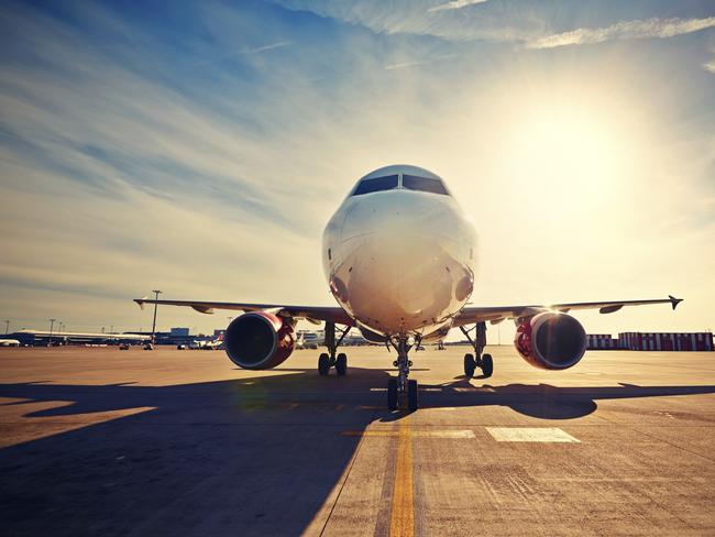 Airplane is taxiing to take off at the sunrise