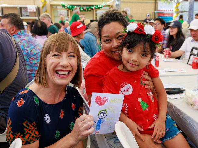 Summer Hill MP Jo Haylen with Tejina Shrestha and her four-year-old daughter Abigail Shrestha, who made a Christmas card for the Prime Minister. Picture: Justin Lloyd.