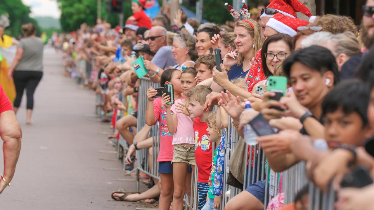 Crowds line the route for the annual Christmas Pageant and Parade down the Esplanade and Knuckey St. Picture: Glenn Campbell