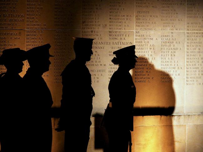 (FILES) In this file photo taken on April 25, 2016, people stand by Australian Memorial of the World War I battle of the Somme in Villers-Bretonneux during the Anzac day in tribute of Australians and New Zealanders soldiers killed in combat. - Popular with British, Belgian, but also Australian and New Zealand visitors, especially for Anzac Day, the museums of the Great War in the French Somme department are fighting back and forth to keep remembrance tourism alive in the face of the health crisis. Every April 25, the dawn ceremony at the Australian memorial in Villers-Bretonneux, gathered in recent years, before the Covid-19 shutdown, some 3,500 people. Among them 70% of Australians, came to commemorate the day in April 1918 when their soldiers stopped the German offensive on Amiens. (Photo by FRANCOIS NASCIMBENI / AFP)