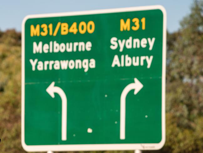 Wodonga VIC, AUSTRALIA - Herald Sun - DECEMBER 21, 2020:Police on the Bandiana Link Road in Wodonga on the NSW Victorian border checking motorists for Border Passes. BYLINE -  Simon Dallinger