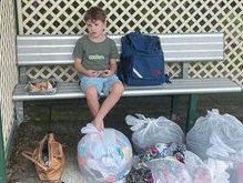 Julie Hindley and her son Archer were displaced from their Graceville home on Monday after it flooded.