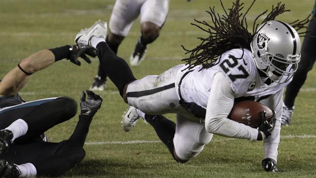 Oakland Raiders' Reggie Nelson, right, is tackled by Philadelphia Eagles' Zach Ertz. picture: AP.