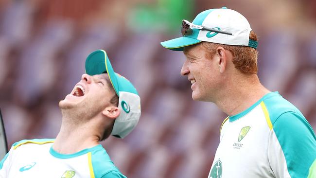 SYDNEY, AUSTRALIA – FEBRUARY 11: Steve Smith of Australia and Australian coach Andrew McDonald share a laugh before the warm-up ahead of game one in the T20 International series between Australia and Sri Lanka at Sydney Cricket Ground on February 11, 2022 in Sydney, Australia. (Photo by Mark Kolbe/Getty Images)