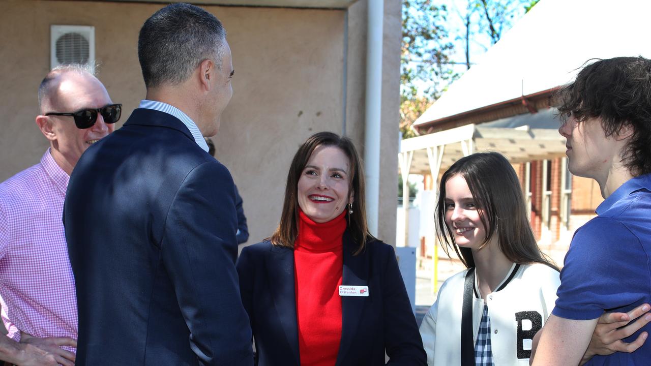 Cressida O'Hanlon, centre, with family, including husband James, left, Phoebe, 11, and Cy, 16, chatting to Premier Peter Malinauskas on Dunstan by-election poll day in March. Picture: Dean Martin