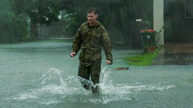 Australian Army soldiers from 3rd Battalion, Royal Australian Regiment, prepare to support the Queensland Police Service during severe weather in Townsville to ensure the safety of residents in high-risk areas. *** Local Caption *** At the request of the Townsville City Council, personnel from the 3rd Brigade have provided Defence Assistance to the Civil Community (DACC) in support of, and under the direction of local emergency services during a severe weather event.  Alongside Queensland Police Service as the lead agency, soldiers from the 3rd Battalion, The Royal Australian Regiment, conducted joint door knocking throughout high-risk areas across Townsville to ensure the welfare and safety of residents. PHOTO: CPL Riley Blennerhassett