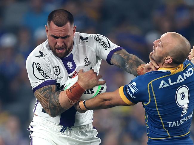 SYDNEY, AUSTRALIA - MARCH 02: Nelson Asofa-Solomona of the Storm Is tackled by Josh Hodgson of the Eels during the round one NRL match between the Parramatta Eels and the Melbourne Storm at CommBank Stadium on March 02, 2023 in Sydney, Australia. (Photo by Cameron Spencer/Getty Images)