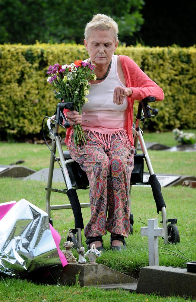 Julie Maybury visits the grave of her murdered daughter Kylie at Fawkner Cemetery. Picture: Andrew Henshaw