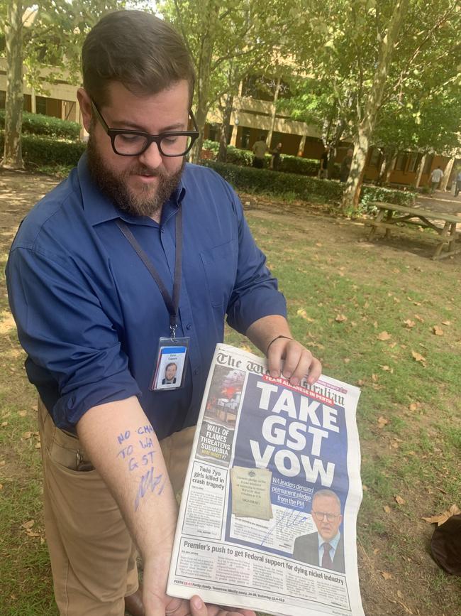 Anthony Albanese signed ‘NO CHANGE TO WA GST’ on the arm of The West Australian journalist Dylan Caporn, who had asked for assurances that the state’s controversial GST top up would not be unwound.