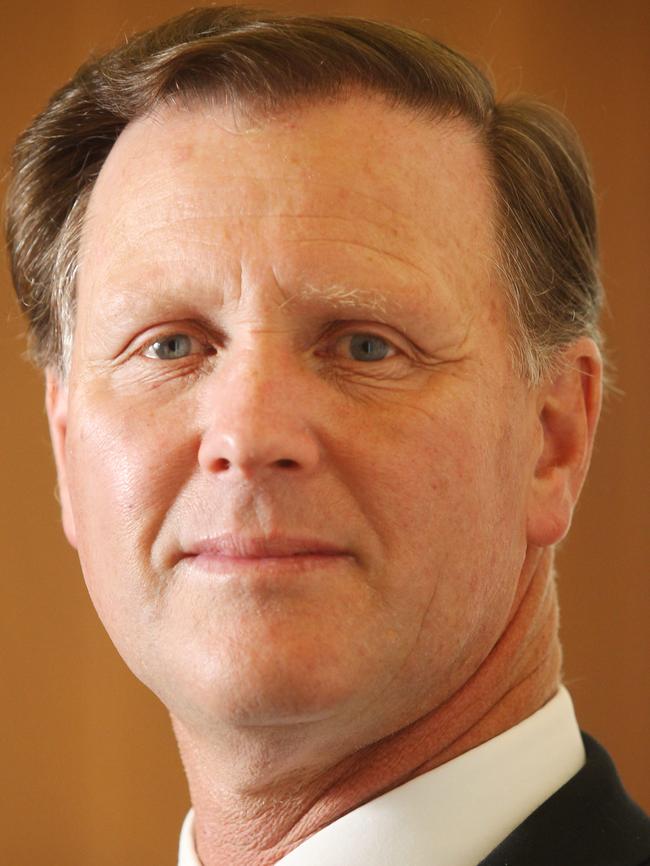 Cr Glenn Aitken brandished a jar of dog poo to back up his argument for keeping the ban.
