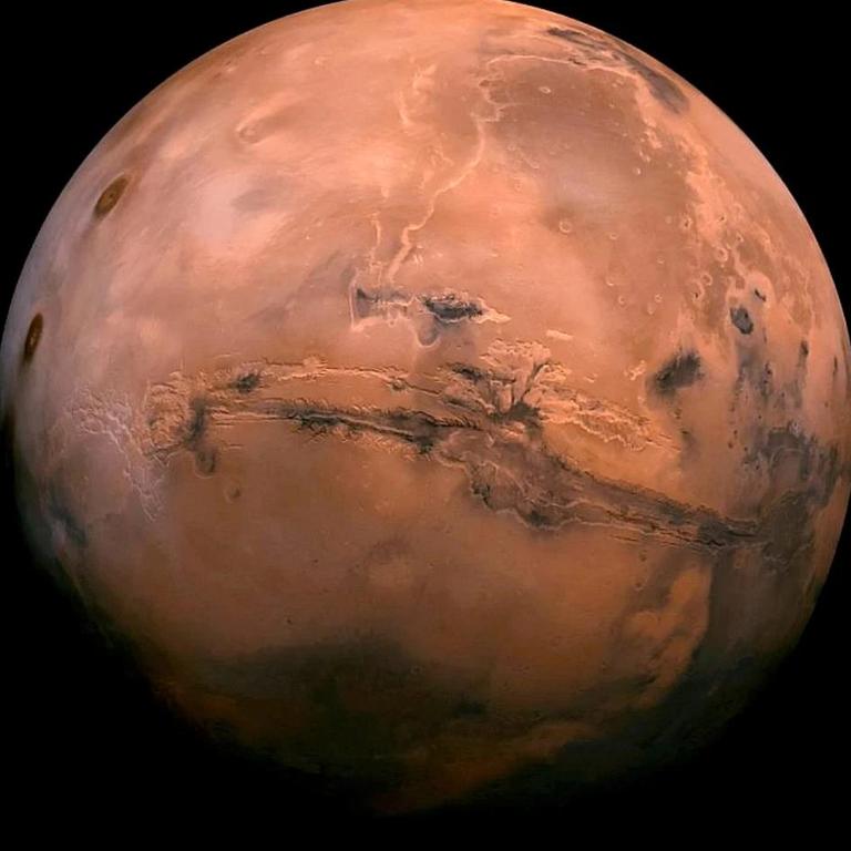 This photo was created from over 100 images of Mars taken by Viking Orbiters in the 1970s. Picture: NASA via AP