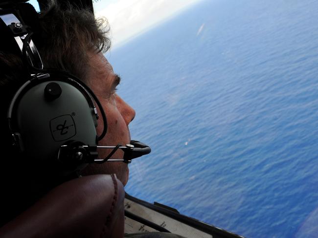 FILE 29 MAY 2014: The Australian Transport Safety Bureau (ATSB) has confirmed that missing Malaysia Airlines Flight MH370 is not in the search zone where acoustic pings were detected. The pings, originally believed to be coming from the missing jet, now thought to have been coming from a 'man-made source', such as a searching ship or equipment used to detect pings. IN FLIGHT - APRIL 11: Co-pilot and Squadron Leader Brett McKenzie of the Royal New Zealand Airforce (RNZAF) P-3K2-Orion aircraft, helps to look for objects during the search for missing Malaysia Airlines flight MH370 in flight over the Indian Ocean on April 13, 2014 off the coast of Perth, Australia. Search and rescue officials in Australia are confident they know the approximate position of the black box recorders from missing Malaysia Airlines Flight MH370, Australian Prime Minister Tony Abbott said on Friday. At the same time, however, the head of the agency coordinating the search said that the latest "ping" signal, which was captured by a listening device buoy on Thursday, was not related to the plane. (Photo by Greg Wood - Pool/Getty Images)