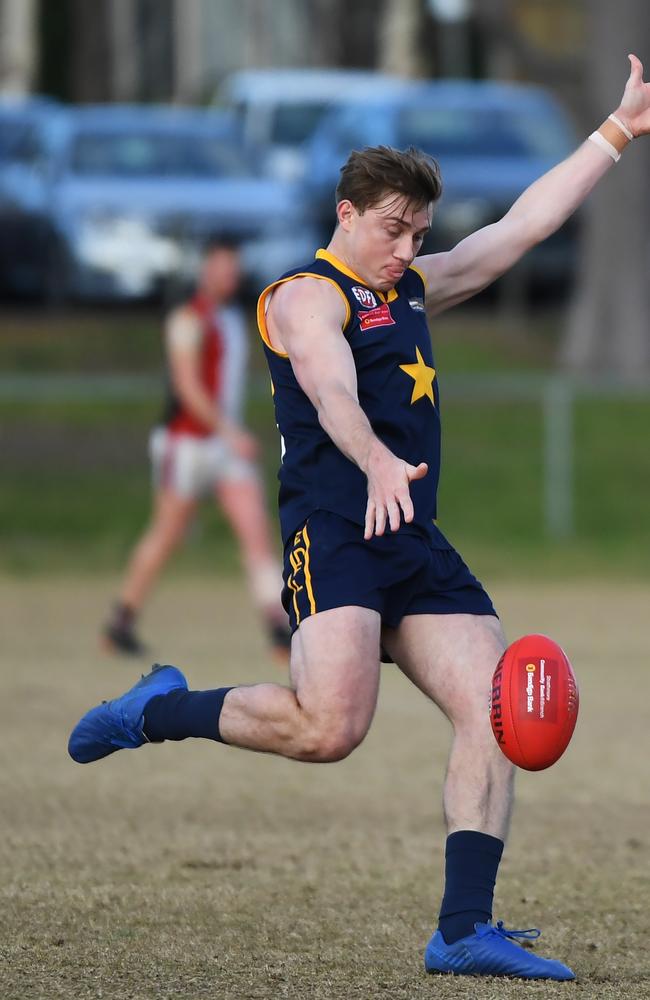 Charles Lill taking a kick for Doutta Stars.