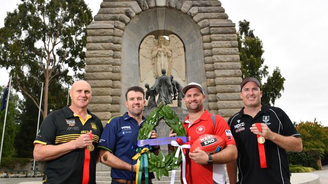 SANFL Anzac Round coaches Brett Hand (Glenelg), Jade Sheedy (Eagles), Jacob Surjan (North Adelaide) and Matthew Lokan (Port Adelaide) at the Adelaide National War Memorial. Picture: Keryn Stevens