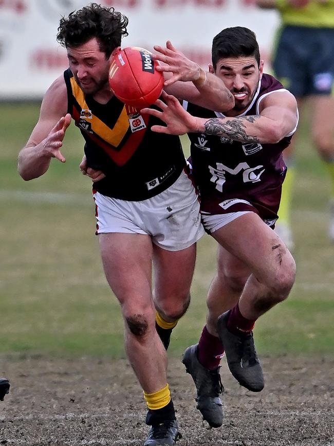 BFL: Tyson Shea of Bacchus Marsh and Melton’s Jaycob Hickey battle. Picture: Andy Brownbill