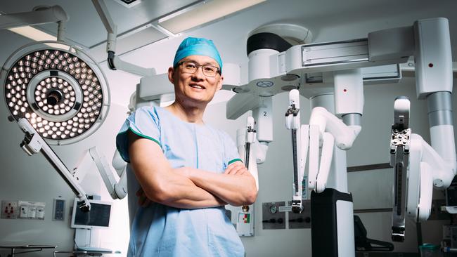 Leading surgeon Felix Chan in the operating theatre at Liverpool Hospital with a robotic surgical system he uses to perform surgery. Picture: Jonathan Ng