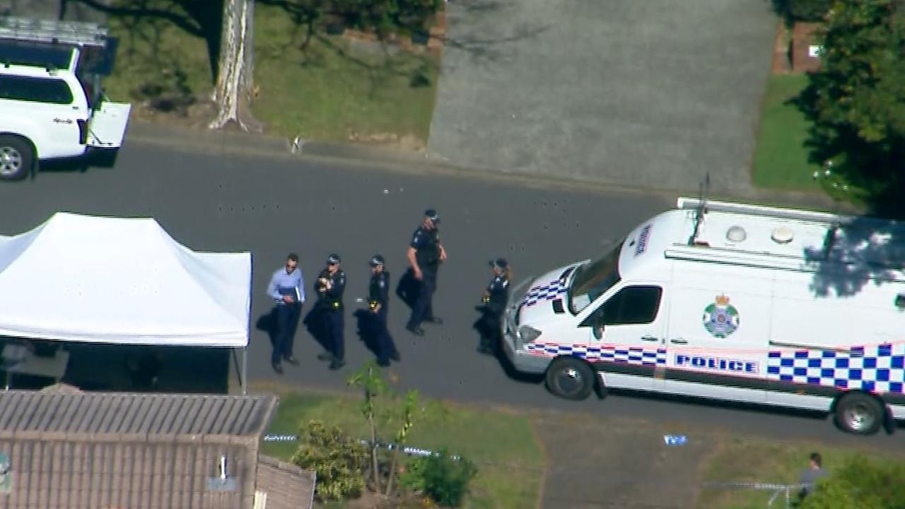 Police at the Stretton home where a woman was found dead on Monday. Picture originally from 7 News Brisbane.