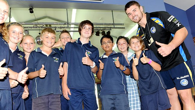 Footy players visit schools to tackle bullying message | Daily Telegraph