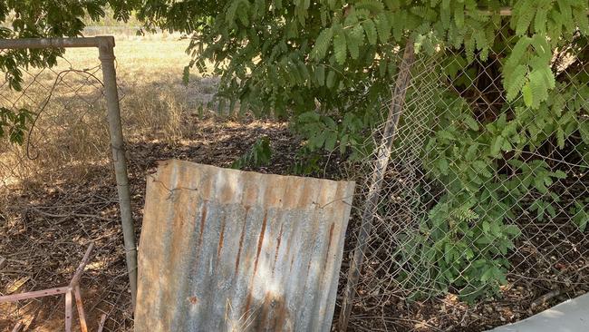 A broken fence in one of the homes.