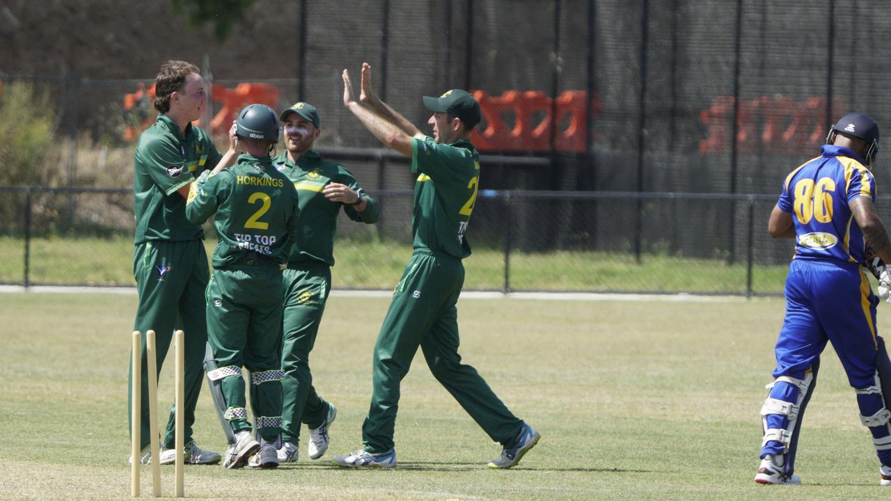 Spotswood players celebrate the wicket of Noble Park batsman Gayan de Silva. Picture: Valeriu Campan