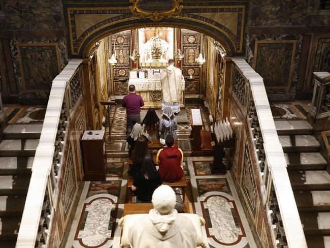 Faithful worship in the Basilica di Santa Maria Maggiore (or the Church of Saint Mary Major) in Rome, Italy. Picture: Getty Images