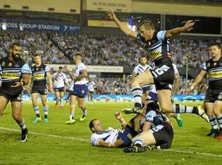 Tyrone Roberts of the Titans scores during the Round 8 NRL match between the Cronulla-Sutherland Sharks and the Gold Coast Titans at Southern Cross Group Stadium in Sydney, Saturday, April 22, 2017. (AAP Image/Craig Golding) NO ARCHIVING, EDITORIAL USE ONLY. Picture: CRAIG GOLDING/AAP