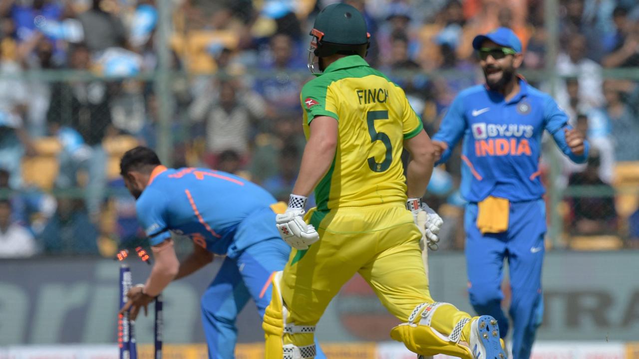 Aaron Finch was run out by a mix-up with Steve Smith.