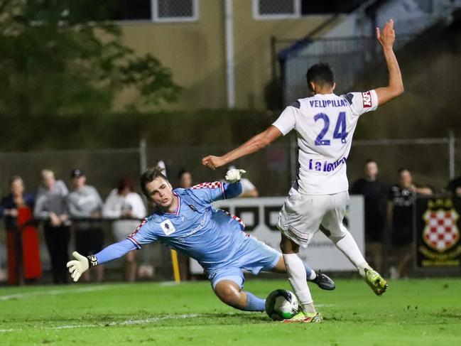 Gold Coast Knights goalkeeper Josh Langdon saves Nishan Velupillay's shot in FFA Cup match v Melbourne Victory at Croatian Sports Park. Picture: Mons Photography