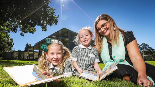 Springbrook State School principal Tilleea Hoskins with Indiana, 6, and Mila, 5, Price. Picture: Nigel Hallett