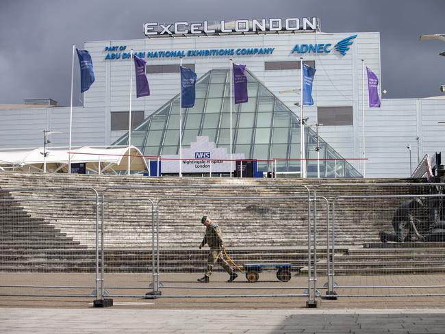 A member of the military walks outside the new NHS Nightingale Hospital at ExCeL London. Picture: Getty Images