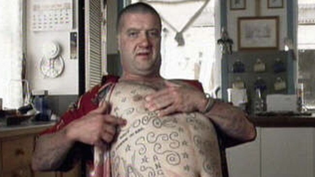 A reformed Read showing off his tattoos in 1991.