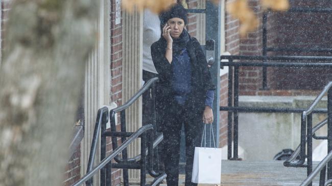 A woman believed to be Kylie Lim appears to be wearing an engagement ring outside Wyman House. Pictures: Angus Mordant