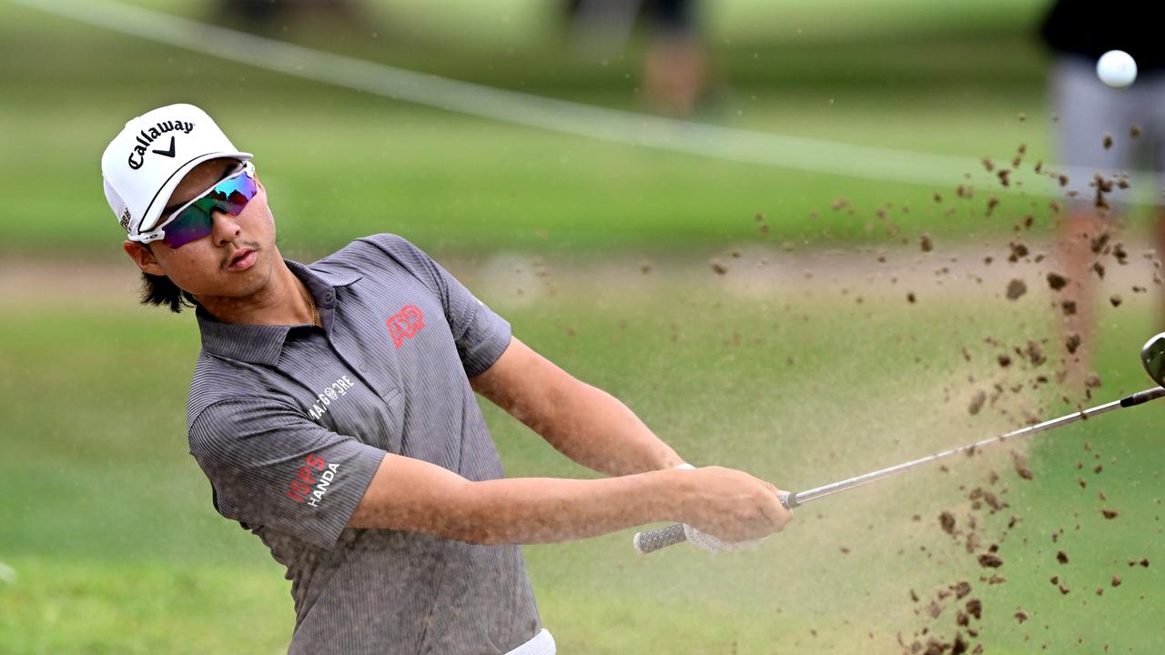 Min Woo Lee plays out of the bunker at the Australian PGA Championship at Royal Queensland. Picture: Bradley Kanaris / Getty Images