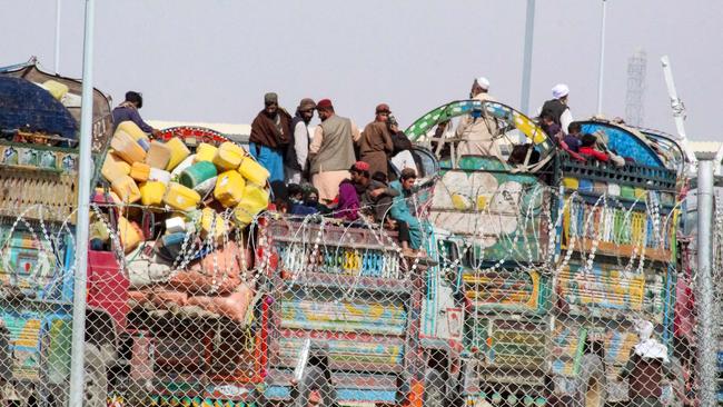 Afghan refugees arrive on trucks at the Pakistan-Afghanistan border in Chaman on Thursday. Picture: AFP