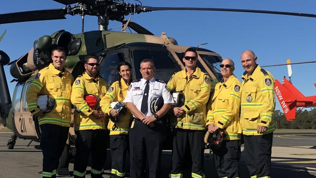 NSW RFS deputy commissioner Rob Rogers (centre) with RFS volunteers at Holsworthy Army Barracks.