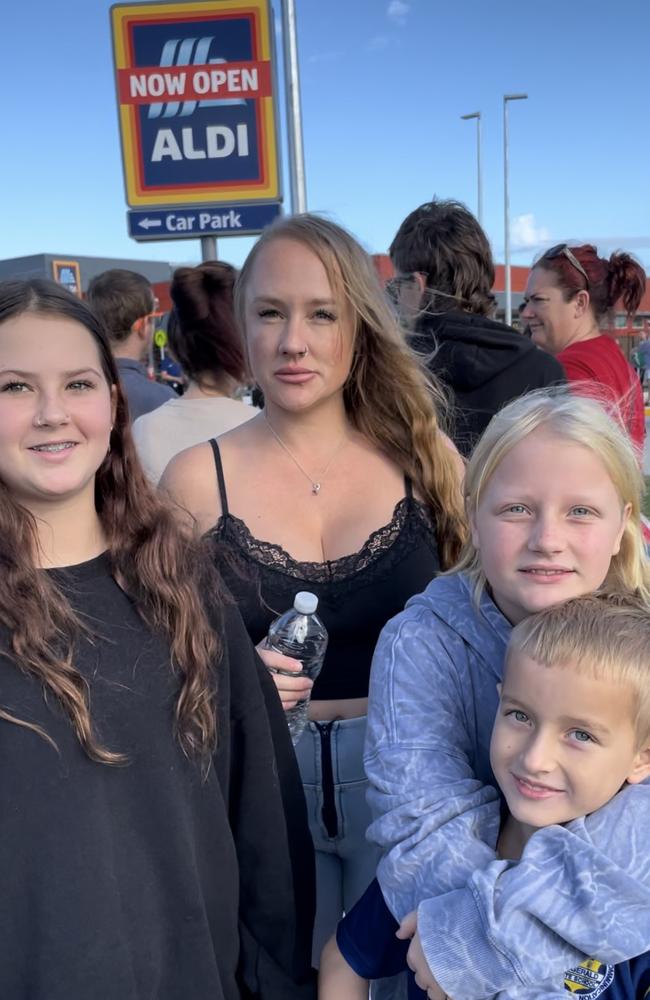 Mother Holly and children Stella, Alice and Beau are excited that the wait is finally over for their first Aldi. Photo: Fergus Gregg