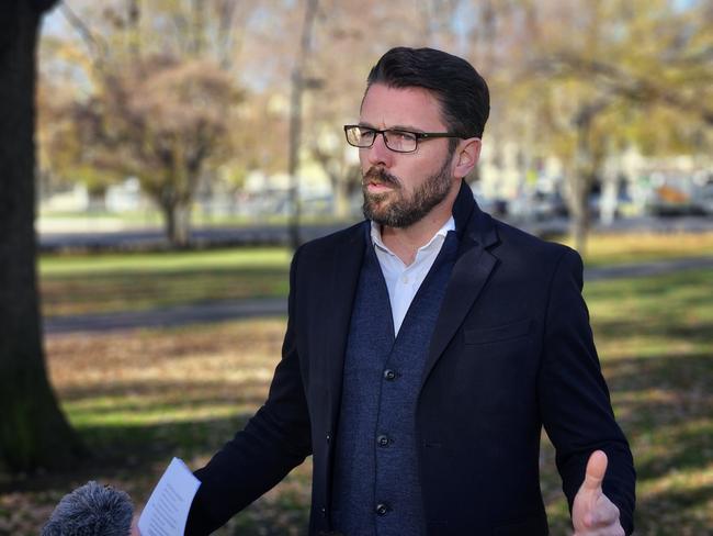 Liberal Senator Jonno Duniam speaks to the media on Parliament Lawns in Hobart.