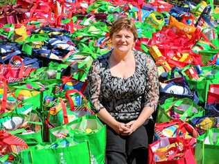 HELP: Cr Janelle Stanford with the 142 hampers put together for the Christmas appeal. Picture: Maranoa Regional Council