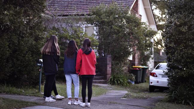 Friday 07 2018 Locals sobbed and sought comfort from loved ones as they left flowers in a tribute outside the house in which Jennifer Edwards and Jack Edwards were shot dead by their father John Edwards. Picture: Flavio Brancaleone