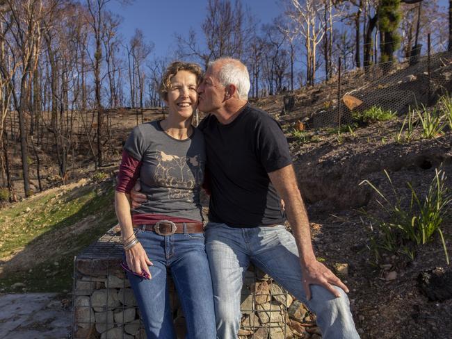 Jani Klotz with partner Patrick Barrie at their property in Tathra, where they are rebuilding their home. Picture: Sean Davey