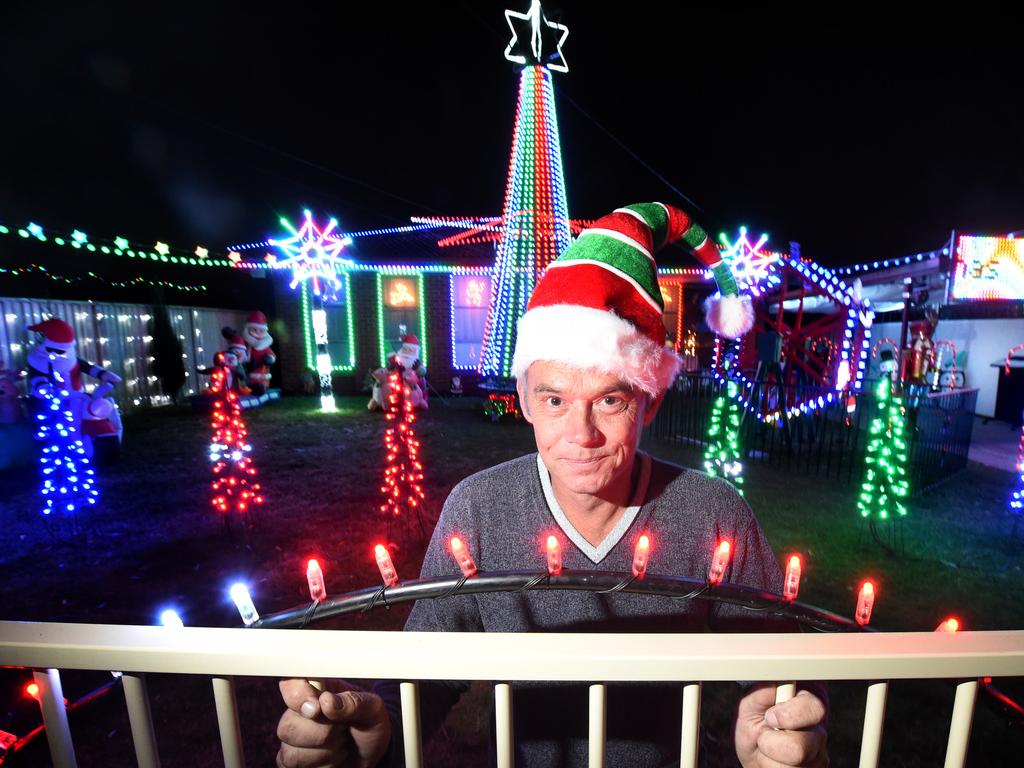 Andrew Seymour in front of his epic light display. Picture: Tony Gough