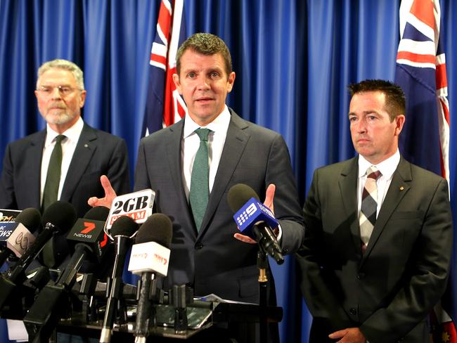 Peter Boxall, chairman of IPART, NSW Premier Mike Baird and Minister for Local Government Paul Toole at last month’s press conference where they announced the tough measures. Picture: Stephen Cooper