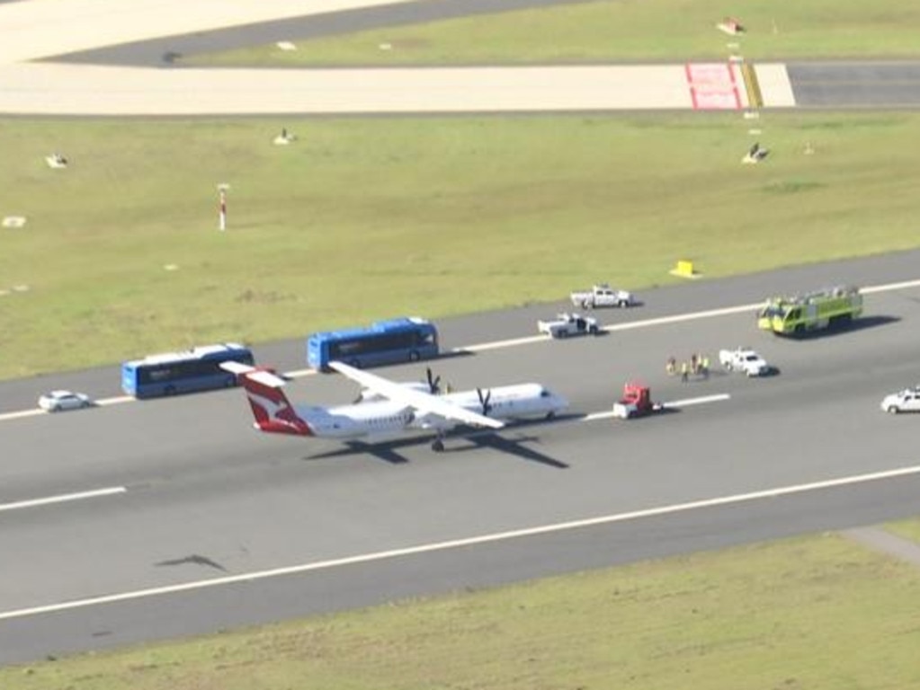 The Qantaslink flight was met on the tarmac by emergency services. Picture: 7 News