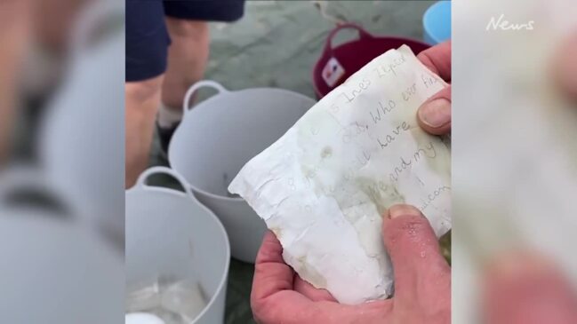 Beach clean-up volunteer finds decade-old, secret note in bottle