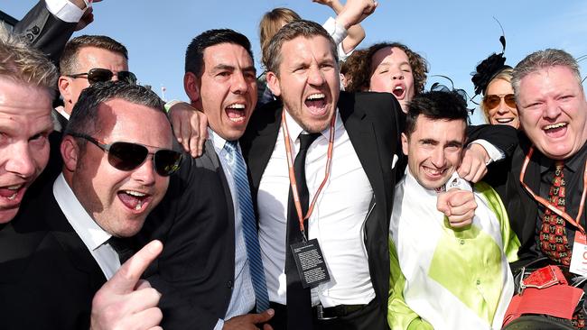 Trainer Peter Gelagotis and the connections of Illustrious Lad celebrate last year’s win on Derby Day. Picture: Nicole Garmston