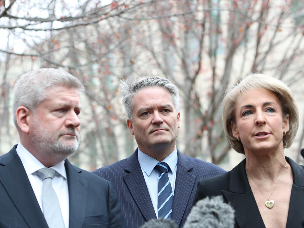 Mitch Fifield, Mathias Cormann and Michealia Cash holding a press conference at Parliament House in Canberra.